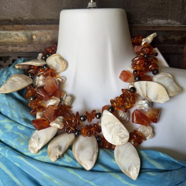 This fit-for-a-mermaid necklace features authentic Baltic Amber, Cornelian, and Natural Pearls and Mother/of Pearl with a 3-Strand design!