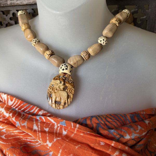 17. The Jasper Carved Elephant Necklace designed by artist Barbara Wright of Dallas, Texas, is a stunning piece of jewelry that features a hand-carved elephant pendant made from African jasper stone.