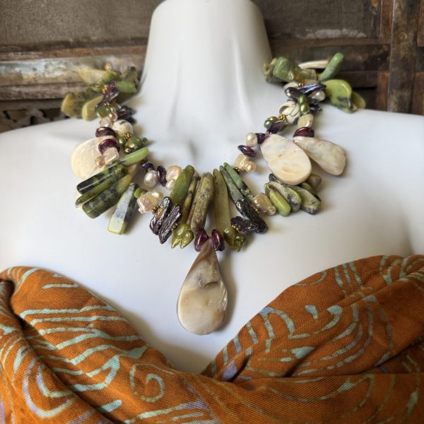 37. This necklace , designed by artist Barbara Wright is a double -stranded green Jasper , Gilded Natural Pearls, and Mother of Pearl Necklace. It is a handmade piece of jewelry that exudes elegance and sophistication.- fit for a mermaid Queen! Each bead is double-knotted by hand on silk thread!