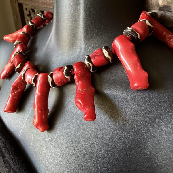 12. This Red Chinese Coral and African Bovine Batik Beaded Necklace by Barbara Wright of Dallas, TX is a stunning piece of ethnic and regional style jewelry. The natural red coral is from the South China Sea and the bovine had-batiked beads from Africa create a beautiful contrast. There is both Asian and African elements together in one design.