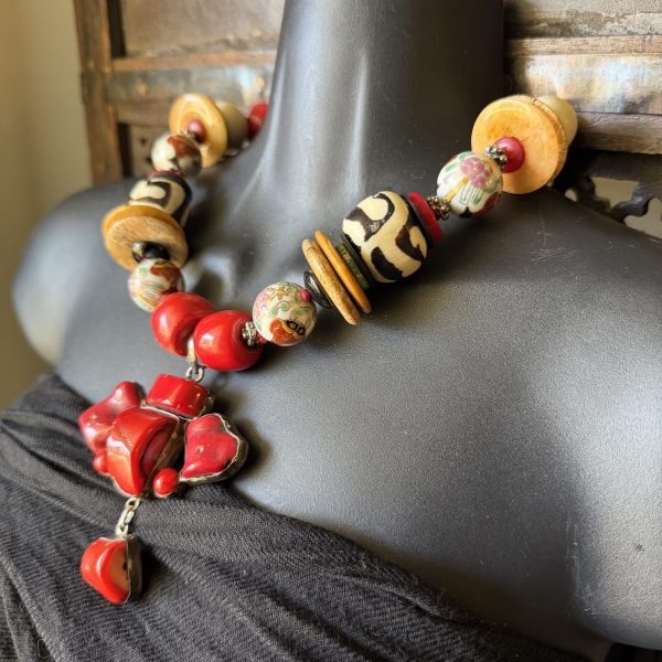 35. This Gorgeous Antique Nepalese Pendant Necklace designed by artist Barbara Wright of Dallas Texas features a stunning combination of authentic coral, onyx, Chinese porcelain, African Batik beads, Jasper, and 925 silver beads!