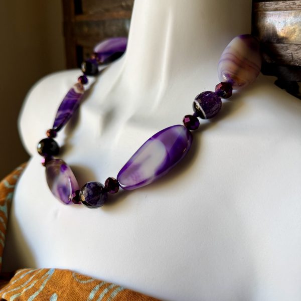 The Beautiful Purple Agate and Amethyst Necklace by Barbara Wright is a statement piece of jewelry that exudes beauty.