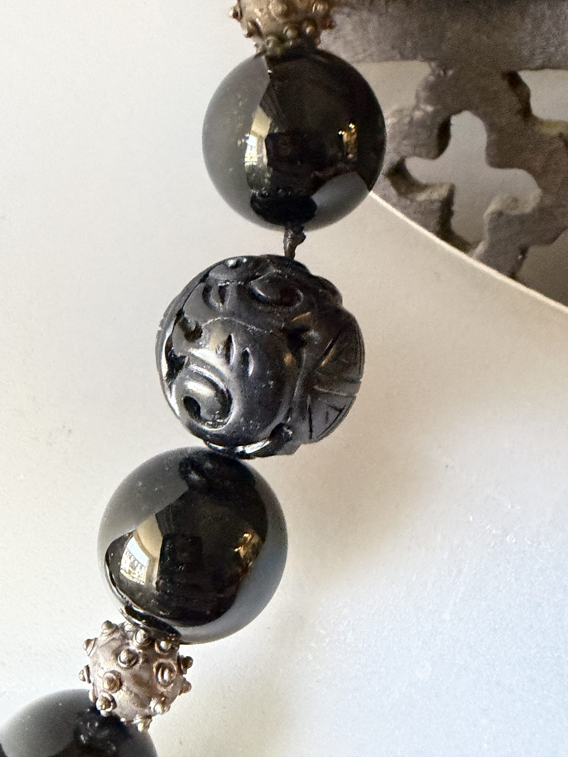 Designed by Barbara Wright of Dallas, Texas, this stunning Black Onyx Statement Necklace showcases a bold oval pendant set in genuine 925 sterling silver. Rich black Mexican onyx stones are paired with distinctive silver beads, creating a sophisticated piece with an elegant, slightly mysterious allure. The hand-knotted beaded design adds both beauty and craftsmanship, with every bead individually double-knotted on silk thread for durability and a luxurious finish. Striking yet versatile, this necklace makes a timeless statement whether dressed up or worn with everyday style. - Image 7