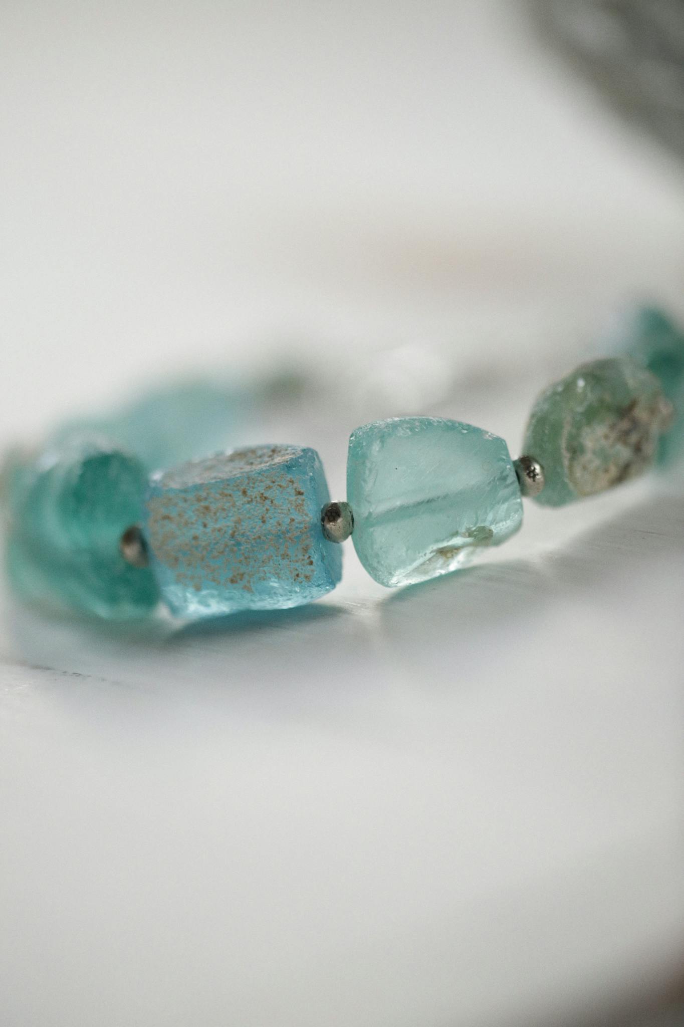 Elegant aquamarine gemstone necklace beautifully captured in close-up with selective focus.