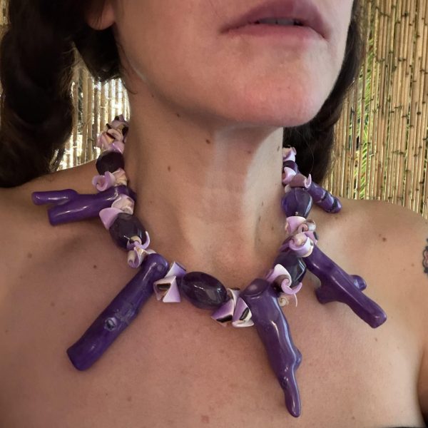 20. This handmade necklace designed by artist Barbara Wright of Dallas, TX, features large, faceted amethyst beads from Russia, purple seashells, and purple coral branches, all luxuriously hand-knotted together to create an elegant and unique piece of jewelry- fit for a mermaid!